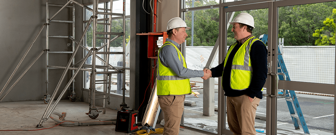 Chad Rapsey shaking clients hand on site